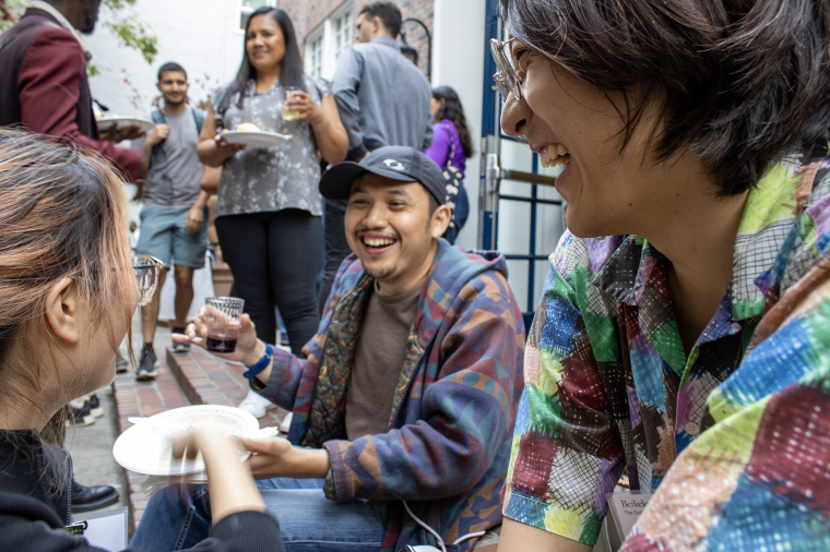 A group of friends eating and laughing